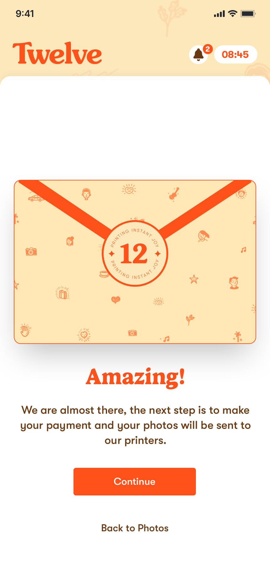 The confirmation screen: an illustrated Twelve envelope closed with a round seal numbered 12, the word &ldquo;Amazing!&rdquo;, a line explaining that payment is the next step before the photos go to the printers, and a single Continue button.